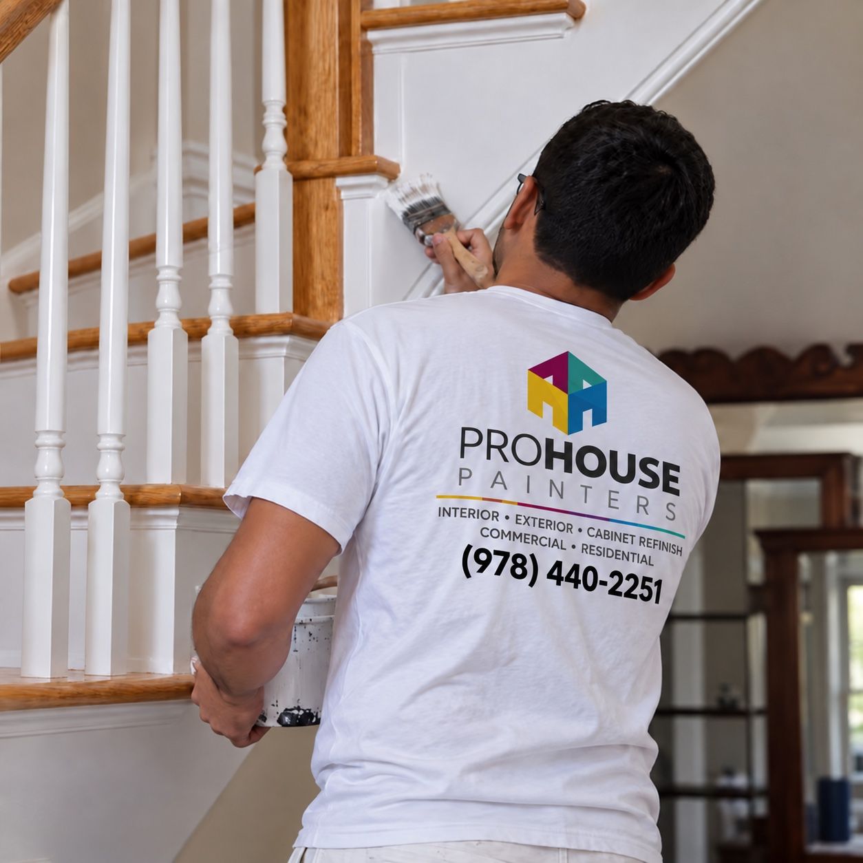 Pro House Painters painter working on a staircase
